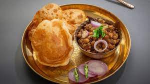The crispy puffed bhatura makes an excellent combo with hot & spicy chole / chickpeas curry. How To Make Punjabi Chole Bhature Chole Bhature Recipe Best Indian Restaurant In Bangkok Indian Food Delivery Amritsr Restaurant