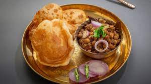 Make this popular chole bhature at home with this easy and simple recipe. How To Make Punjabi Chole Bhature Chole Bhature Recipe Best Indian Restaurant In Bangkok Indian Food Delivery Amritsr Restaurant