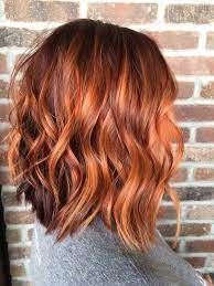 The fluffy textured style will look very stylish on women who have a prominent and slick jawline. Dark Copper Short Hair Color Novocom Top