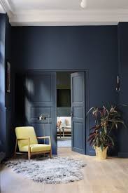 They have used two complementing shades of blue to break up. Love The Midnight Blue Pop Of Colour With The Yellow Chair House Interior Interior Blue Interior