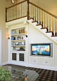 A Staircase With Bookshelves And A Tv Integrated And Some Storage Drawers Saves A Lot Of Storage S In 2020 Living Room Under Stairs Staircase Storage Room Under Stairs