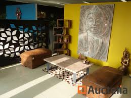 Connected to the other green room is a room featuring a foosball table. Mortex And Metal Coffee Table Poufs Shelf Buddha Buddha Mural Painting