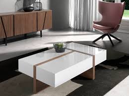 Think about the colour and material. Espanol Mesa De Centro En Madera En Nogal Con Tapas Lacadas Angel Cerda S L