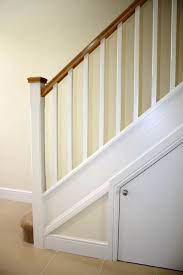 This is the previous owner's stuff swimming in a sea of oak. Stairs White Spindles Carpeted Interior Stair Railing Staircase Design Staircase Banister Ideas