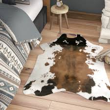 Use a damp cloth or sponge to apply the soapy water to the cowhide rug. Loon Peak Armor Animal Print Faux Cowhide White Brown Area Rug Reviews Wayfair