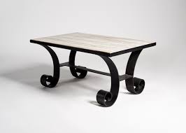 In the 1970s and this table is signed with the original label. Rectangular Stone Topped Coffee Table Wrought Iron Marble Collection Maison Gerard