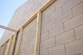 How To Cover A Cinder Block Interior Ehow Cinder Block Walls Cinder Block House Concrete Block Walls