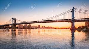 Awesome streaky yellows and oranges looking toward midtown manhattan from brooklyn bridge at sunset. Manhattan Bridge At Sunrise Viewed From Brooklyn Bridge Park Stock Photo Picture And Royalty Free Image Image 50229371