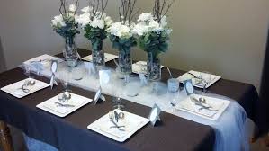 To dress up the table, paint some simple designs on napkins using fabric paint. Elegant Dollar Store Dinner Party Dinner Party Table Settings Party Table Centerpieces Dinner Party Table