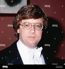 Music Director and Conductor of the Toronto Symphony Orchestra, Sir Ernest  MacMillan, at piano, surrounded by Student Council executives Janet Adset  of Humberside Collegiate, S.R. Neilly of Riverdale, Bernice Russell of North