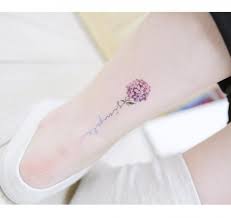 16 Delicate Flower Tattoos Just In Time For Your New Spring Ink Cute Ankle Tattoos Tattoos Ankle Tattoos For Women