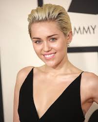 4, keeping her blonde hair back in a casual bun. It S Official Miley Cyrus Is Going Back To Her Dark Hair Roots