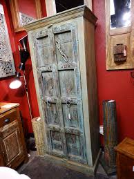 Embossed star panel in solid copper $21.95. This Wood Cabinet Has Tall Doors With A Blue Green Rustic Finish
