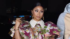 The rapper, 37, shared a series of extravagant photos on her instagram account which showed her cradling her bump while wearing a floral bikini, high heels and colourful wigs. Nicki Minaj Calls Out Twitter Page Showing A False Photo Of Her Child Complex