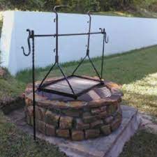 The grill has 3 chains rising from the grill, ending in a hook. Pin By Mike On Blacksmith Outdoor Fire Backyard Fire Outdoor Fire Pit