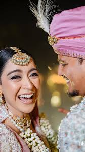 Witness the magic of subtle glam with our beautiful bride adorned in a  stunning pink lehenga. Her radiant look perfectly captures elegance and  grace, making her special day even more memorable., In ...