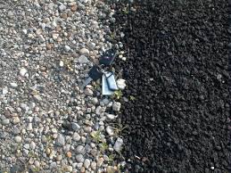 Unless you install concrete edging to hold in the hot mix, the edges of an asphalt driveway tend to be less than perfect. Asphalt Driveway