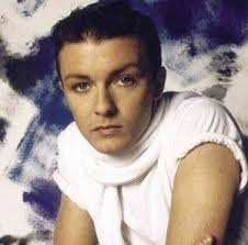 Ricky Gervais AS A POP singer in the 1980s.