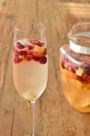 Champagne Sangria For The Holiday Season Recipe Champagne Sangria Sangria Recipes Sparkling Sangria