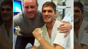 Nick Blackwell pictured sitting up and smiling from hospital bed after  visit from trainer Gary Lockett