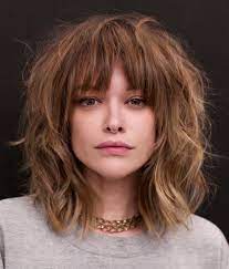 This bangs hairstyle is best suited for western dresses. 25 Latest Medium Length Hairstyles With Bangs For 2021