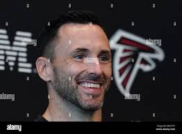 Atlanta Falcons assistant general manager Kyle Smith speaks to the media  before the first day of team's NFL football training camp pratice  Wednesday, July 26, 2023, in Flowery Branch, Ga. (AP Photo/John
