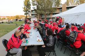 Athletes enjoy a welcome aboard dinner at the information