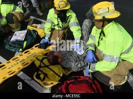 Master Sgt. Matt Henning,132d Wing Command Support Staff, acts as a  casualty during an active shooter drill at Joint Base Pearl Harbor-Hickam  in Honolulu, Hawaii. The drill was conducted to measure the