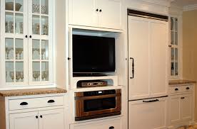 This kitchen is provided an area to sit and read in some existing chairs that drove the deeper color of the bar. 20 Awesome Flat Screen Tv Furniture In The Kitchen Home Design Lover