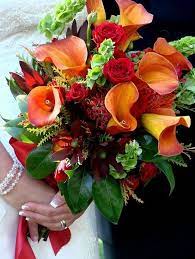 A classic wedding flower that is in season for fall is the ubiquitous calla lily. Orange Calla Lily Wedding Boquet Calla Lillies Wedding Calla Lily Bouquet Wedding Calla Lily Wedding