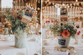 Maybe you would like to learn more about one of these? Rustic Wedding Flowers And Photos Of Bride And Groom Were Used As Table Centrepieces At Clock Barn Hampshire Clock Barn Weddings