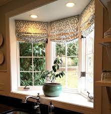 Kitchen bay window treatments image and description. Custom Roman Shades In Lacefield Imperial Bisque Fabric By The Yard Via Cottage And Vine Blog Inte Bay Window Treatments Bay Window Decor Kitchen Bay Window