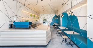 The Interior Of This Cafe Is Covered In Geometric Panel Shapes Modern Interior Design Restaurant Design Cafe Interior