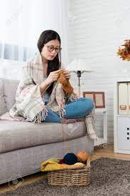 Maybe you would like to learn more about one of these? Beauty Asian Woman Put The Blanket On Body And Knitting For Coming Season Sitting On Sofa In The Living Room At Home In Autumn Season Stock Photo Picture And Royalty Free Image