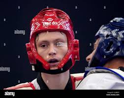 Great Britain's Cameron Booth (left) in action against Greece's Dimitrios  Peltekis during day four of the European Taekwondo Championships 2022 at  the Manchester Regional Arena, Manchester. Picture date: Sunday May 22, 2022
