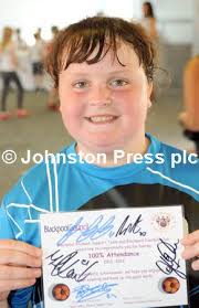 25015305-Pictures Martin Bostock Schoolchildren from Blackpool schools at a  special party at Blackpool football club to celebrate their 100%  attendance. Bethany Middleton of Stanley school.
