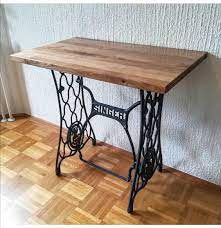 Measurements are 28.5 inches wide, 21 inches deep, and 29 inches tall. Reused An Old Singer Sewing Machine Table Woodworking