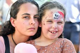 OUT AND ABOUT: Families turn out for Carols in the City