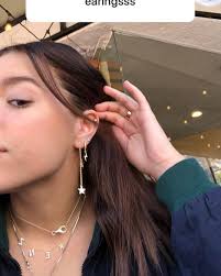 her earrings all look so cute together kenz liked ear piercings fake earrings ear