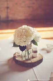 Diy Hydrangea And Wood Round Centerpiece Hydrangea Centerpiece Wedding Hydrangeas Wedding Rustic Wedding Centerpieces