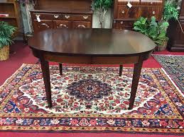 Most dining tables have leaves that allow the table to expand from being able to seat four to six people to seating as many as 12. Biggs Mahogany Dining Table With Two Leaves Bohemian S