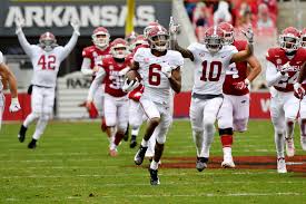 Soccer ball, american football and baseball in yellow glove on green grass. Supreme Court To Rule On N C A A Limits On Paying College Athletes The New York Times