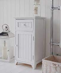 These clean white shelves are. A Crisp White Freestanding Bathroom Storage Furniture A Narrow Bathroom Cabinet Freestanding Bathroom Storage Bathroom Furniture Storage Bathroom Freestanding