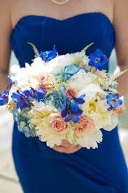 White, cream, silver, and green combine well with both purple and blue, while yellow is a lovely accent color. Cobalt Blue Peach Wedding Color Inspiration Bridesmaid Bouquet Peach Wedding Peach Wedding Colors