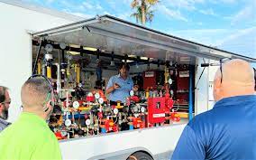 The Reliable Automatic Sprinkler Co. Inc. - George Nicola (Technical Services) holds court with the Reliable Demo Trailer at Daytona Beach for the Florida Fire Sprinkler Association. Great venue, great people, great