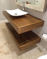 Vanity floating shelves of reclaimed wood and a mirror frame of the same material. Carved Woodworks Custom Bathroom Vanity Bathroom Vanity Remodel Floating Bathroom Vanity