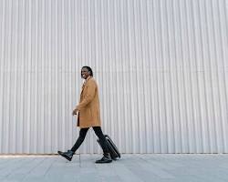 Smiling man with a suitcase