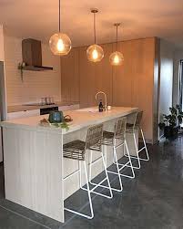 While pendant lighting does supply direct lighting over and island, sometimes it can be more decorative if there is a good wash of light surrounding the space. Large Round Glass Pendant Light Ariana Bronze Ivory Deene