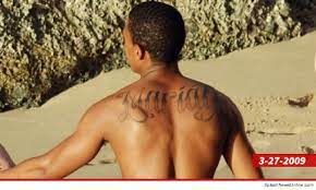 Hers is easily covered up and is hard to see. Nick Cannon Wild N Out With New Massive Back Tattoo Photos