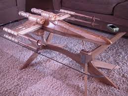 If you're a fan of star trek, and you're looking for a piece of furniture that represents your allegiance to the franchise, this uss enterprise table might be right up your alley.created by artist barry shields, it is made from ash, poplar and cherry wood. Awesome Starship Coffee Tables